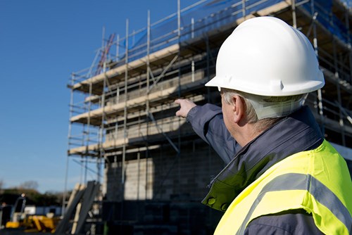 man pointing on construction site