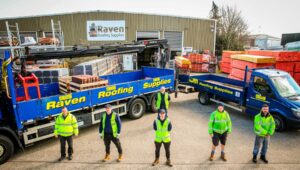 Raven Roofing Supplies depot with two trucks and staff stood outside