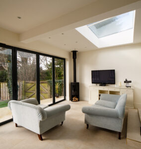 Surespan Living area with skylight installed above furniture