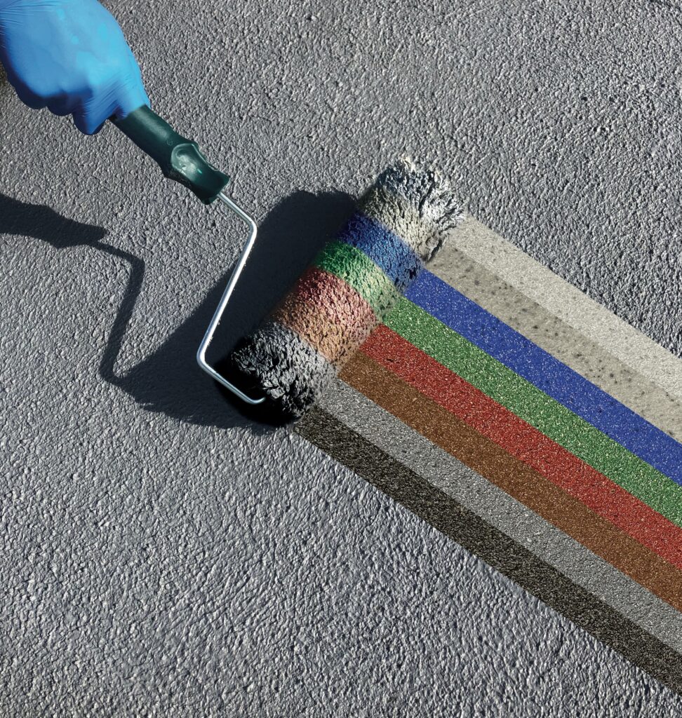 Paintbrush demonstrating the variety of colours available for water-based bitumen