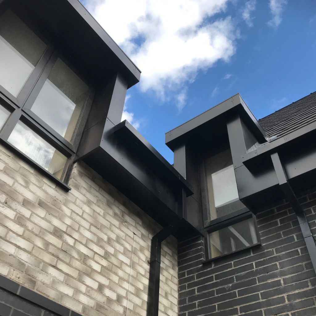 Close up detail of bricks and black windows