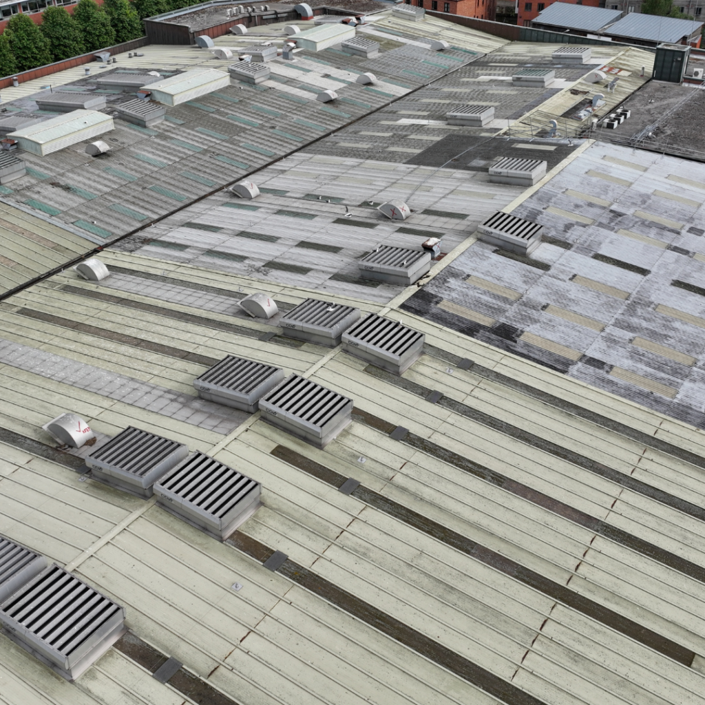 An ariel view of an industrial roof in need of repair